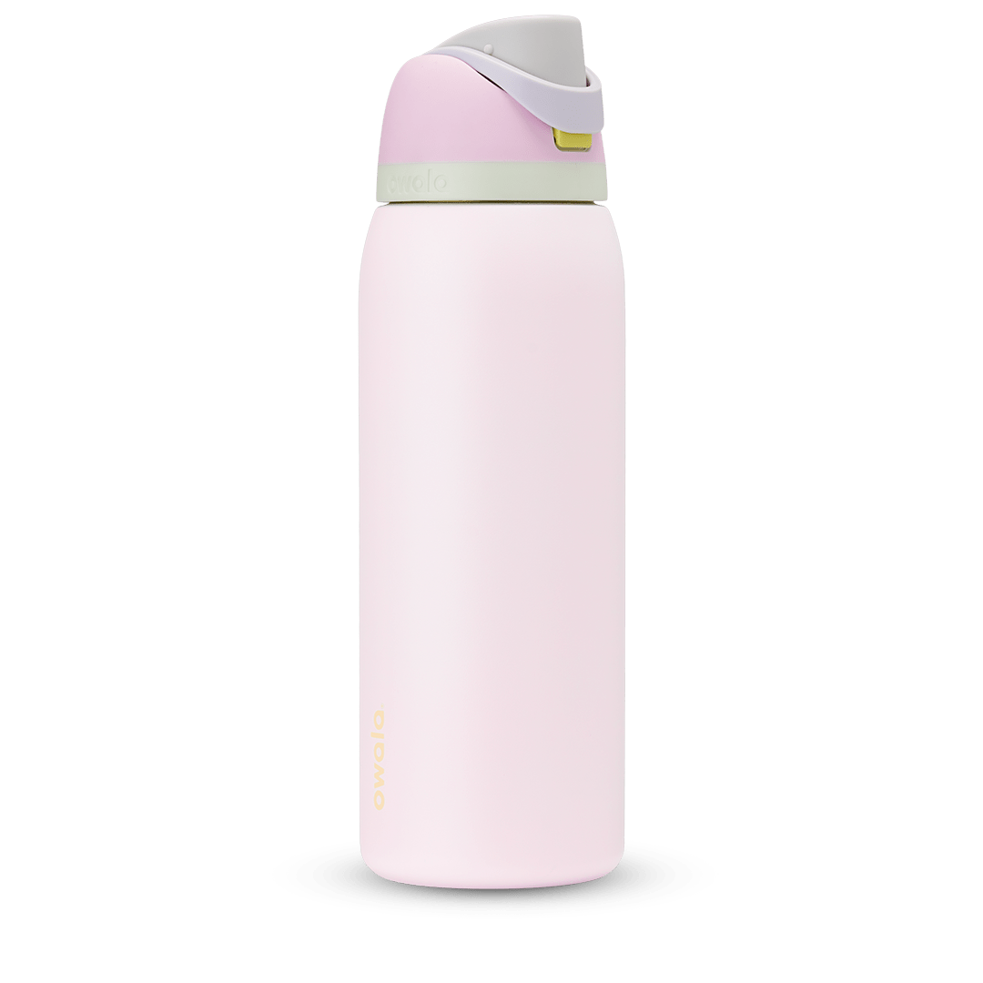 FreeSip 40oz water bottle, soft blush pink body with pale pink and sage green color-block flip cap